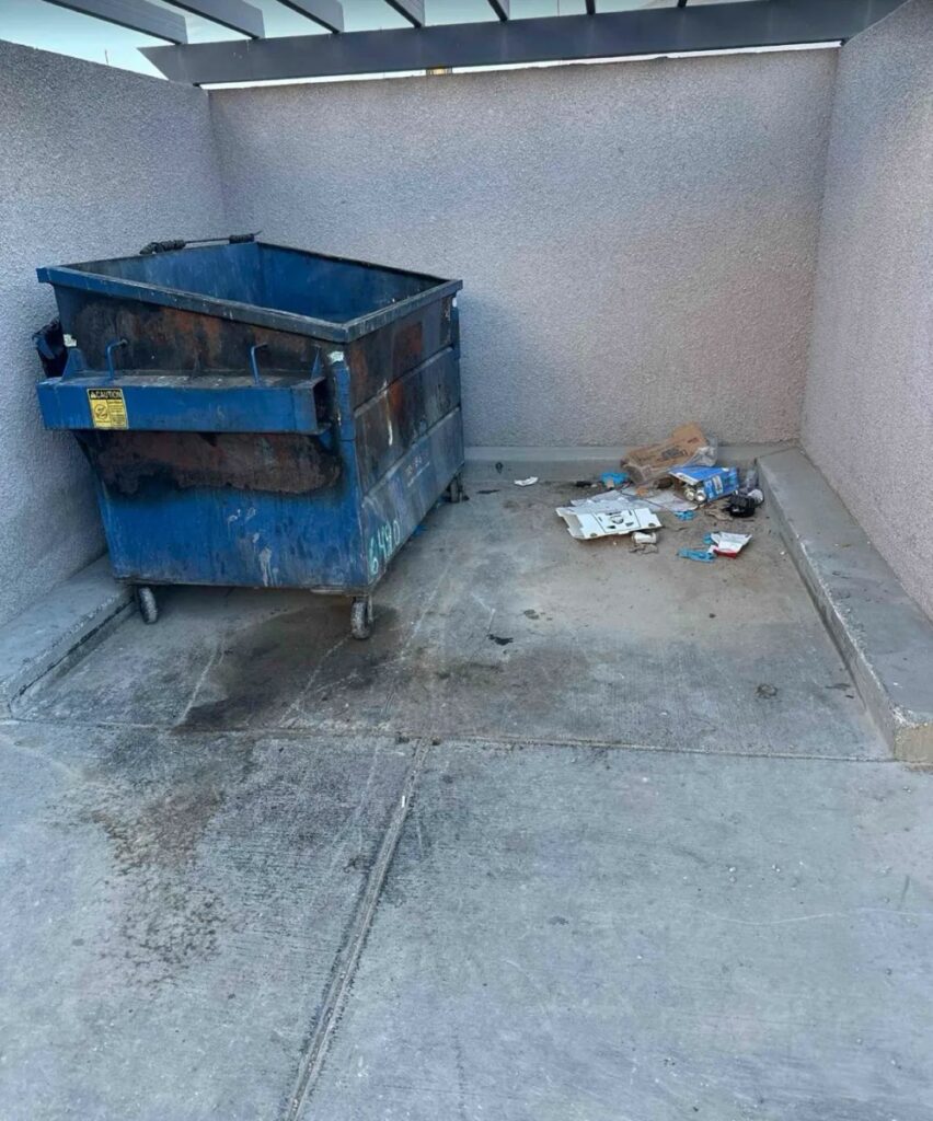 Dumpster enclosure before